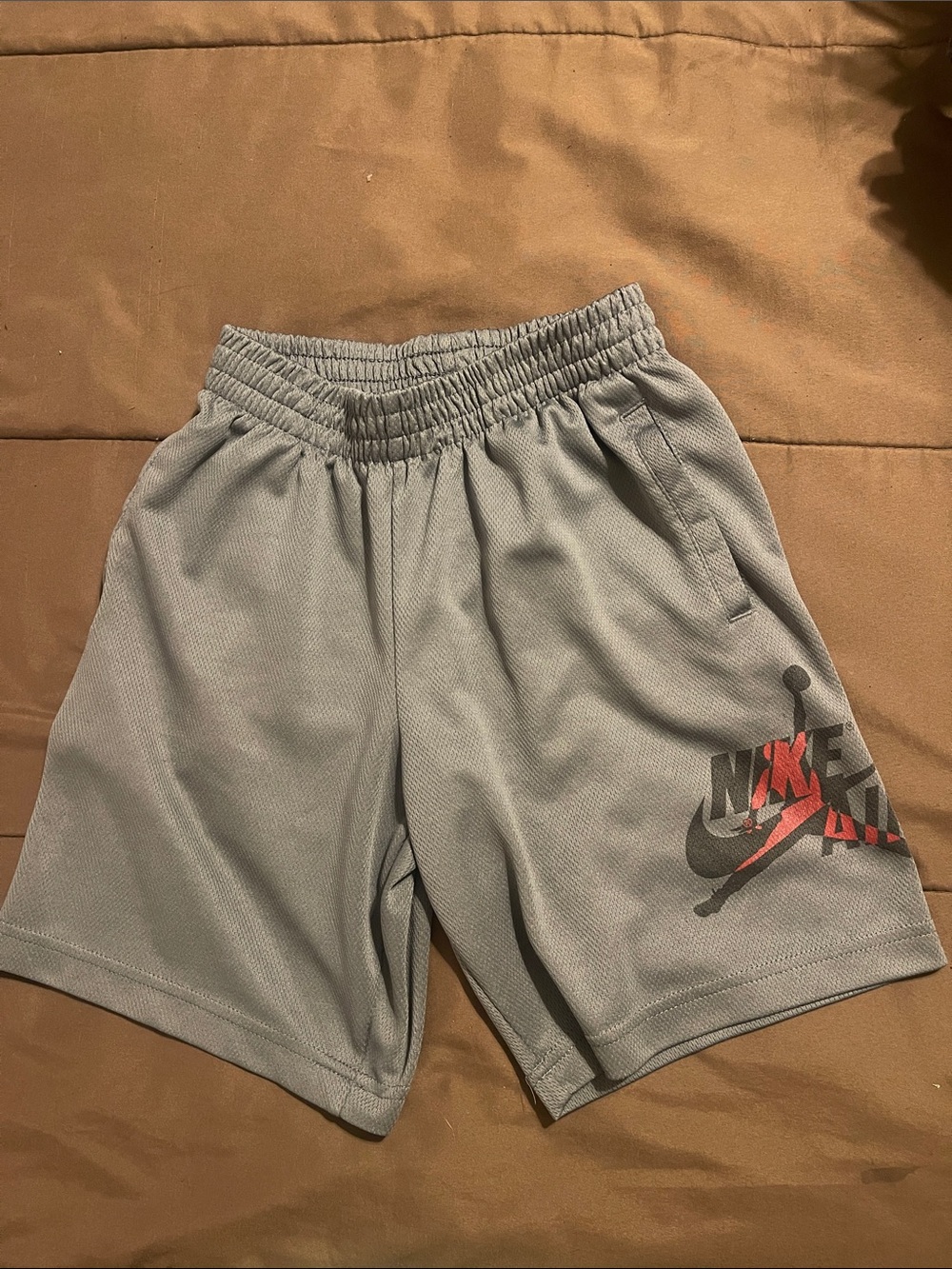 Jordan boys Light Gray Athletic Shorts with Black and Red Logo